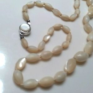 AN ANTIQUE MOTHER OF PEARL GRADUATED OVAL BEADS 20" STERLING LOCK. SB.17